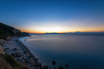 Fototapeta premium Greece, Sunset over beach