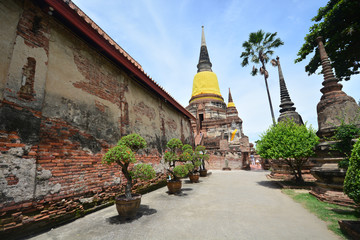 Old monk statue in old brick temple, Wat Yai Chai Mongkol in Ayutthaya of Thailand