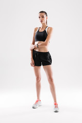 Full length portrait of a young fit sportswoman posing