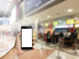 hand holding phone with check in airport background