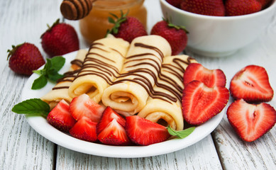 crepes with strawberries and chocolate sauce