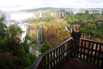 Fototapeta na wymiar young woman near Iguazu Falls on Argentina and Brazil Borders