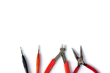 Flat lay of various craftsman tools or hand tools on white background with copy space using as construction tools, workshop and craft concept.