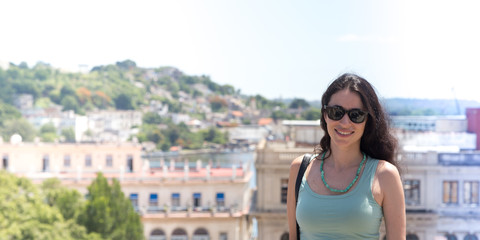Fototapeta premium Havana, Cuba; tourist girl photographed in the old city