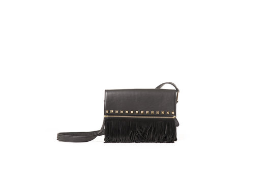 Small women's black leather bag on an isolated background.