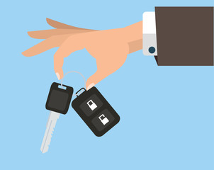 Businessman's arm holding car key