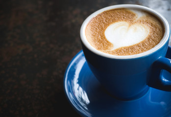 Coffee latte art with heart on top with copy space
