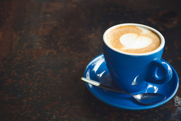 Coffee latte art with heart on top with copy space