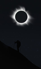 Man watching total eclipse during hiking 