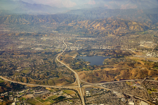 Aerial view of San Dimas and Puddingstone Reservoir, view from window seat in an airplane