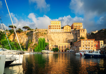 Fototapeta premium boats embankment and city of Sorrento, southern Italy, retro toned