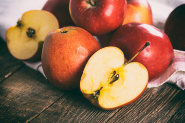 Naklejka na ściany i meble Fresh apples on wooden surface