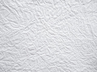 White crumpled paper background.