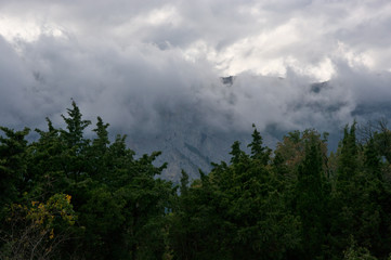 Mountain in dense fog and clouds