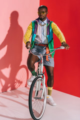 stylish man riding bicycle