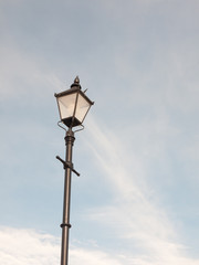 Fototapeta na wymiar black outside street lamp with blue and cloud sky