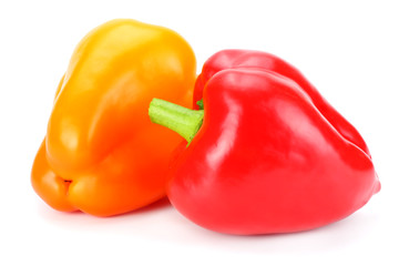 two red and yellow sweet bell peppers isolated on white background