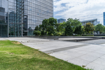 modern office buildings near meadow in midtown