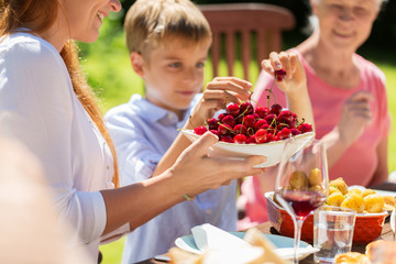 happy family having dinner or summer garden party