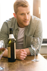 man with bottle of wine