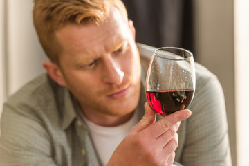 man with glass of wine
