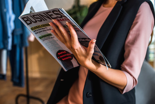 Girl Reading Business Magazine