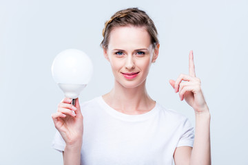 attractive woman with light bulb