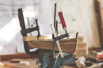 handcrafted craftwork of a wooden boat model / a phase of creating a wooden model of a traditional Italian boat