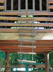 Rope wooden ladder.