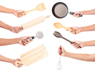 Chef's hands holding kitchen utensils/many equipments for food isolated on white background