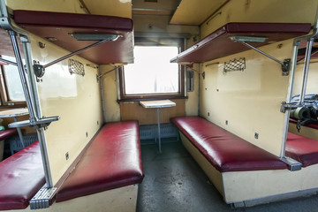 Fototapeta premium Vintage train interior with sleeping car seats
