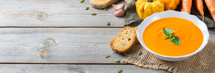 Fall autumn roasted orange pumpkin carrot soup with garlic
