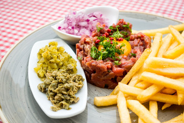 tasty Steak tartare (Raw beef) - classic steak tartare on white plate