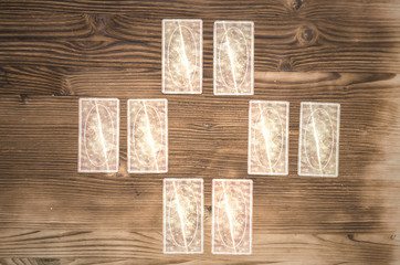 Tarot cards on wooden table. Fortune teller.
