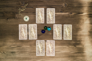 Tarot cards on wooden table. Fortune teller.