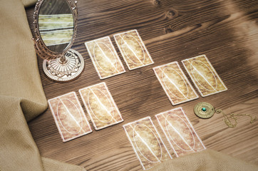 Tarot cards on wooden table. Divination. Fortune teller.