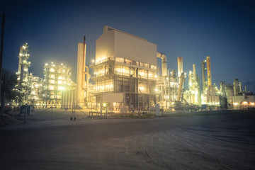 Oil refinery, oil factory, petrochemical plant at blue hour in Corpus Christi, Texas, USA. Vintage...