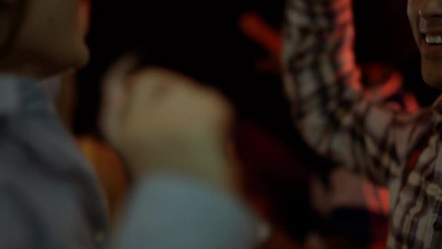  Close up portrait young couple dancing & flirting at party or night club