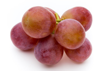 Ripe red grape isolated on white.