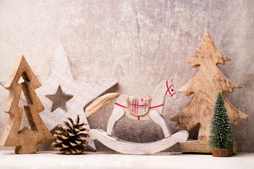 Christmas tree decorations on a wooden background. With bokeh ornaments.