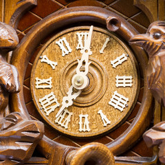 Fototapeta na wymiar Front of a vintage clock made by wood