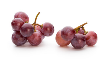 Ripe red grape isolated on white.