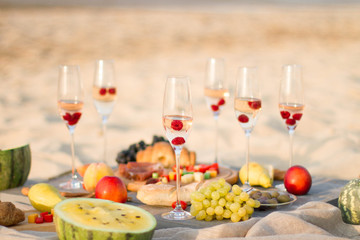 Group of friends enjoying  with champagne at the Beach