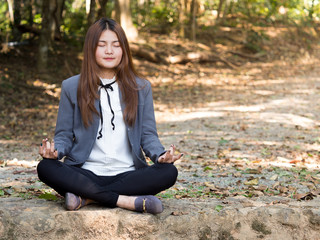 Young asian businesswoman yoga in forest, relaxing for working meditation, business lifestyle and wellbeing concept