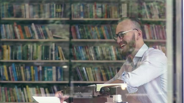 Smiling man in a library