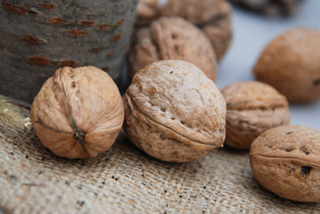 autumn composition with chestnuts,nuts on rustic background
