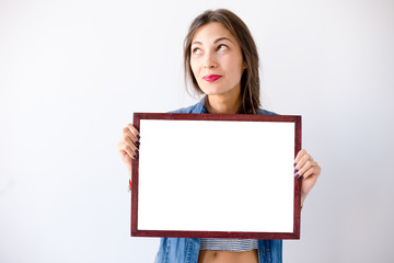 Fototapeta premium Close-up dreaming girl with a board