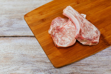 Raw pork steak with rosemary ready for cooking