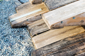 Wooden rafting boats on a pile on the river bank