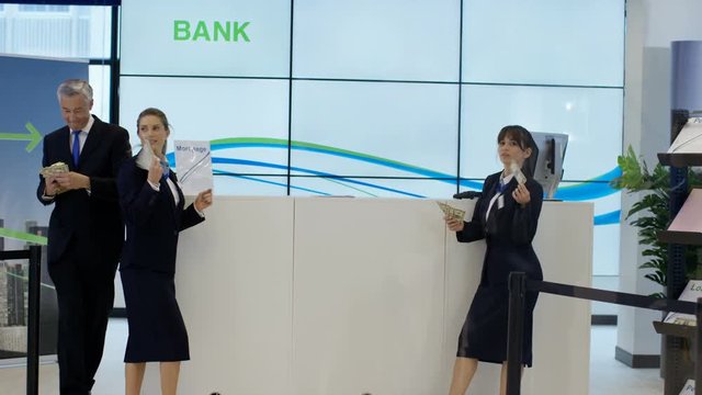  Bank workers showing off with lots of money & throwing notes in the air